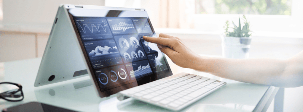 high tech touchscreen computer with keyboard and hand touching display